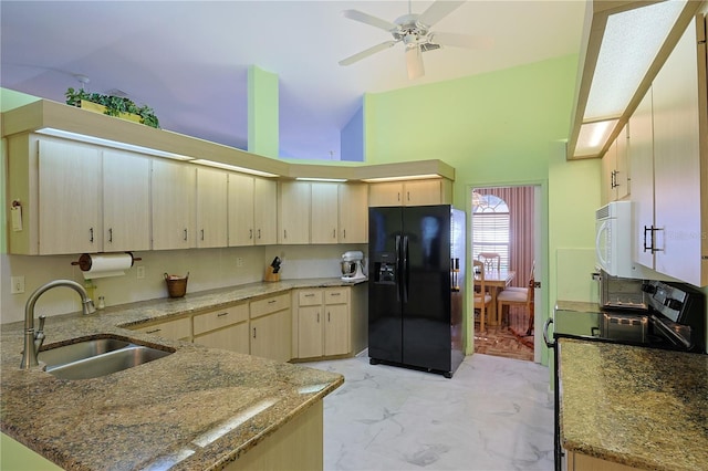 kitchen with white microwave, a sink, electric stove, marble finish floor, and black refrigerator with ice dispenser