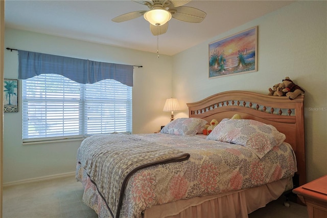 bedroom with baseboards, carpet floors, and ceiling fan