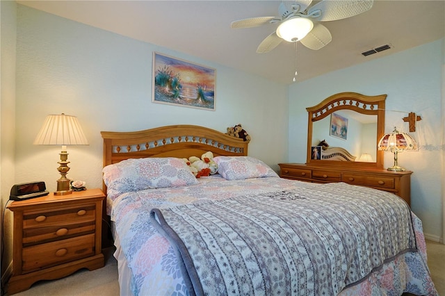 bedroom with visible vents, carpet flooring, and ceiling fan