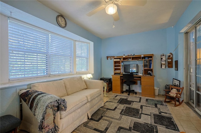 home office featuring light tile patterned floors and ceiling fan