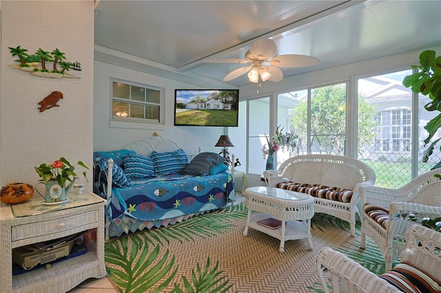 sunroom with outdoor lounge area and a ceiling fan