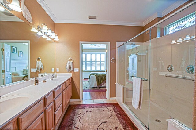 13968 SE 96th Cir, Summerfield, FL 34491 - ensuite bathroom with crown molding, double vanity, a stall shower, and baseboards