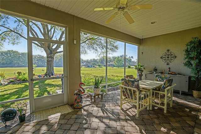 13968 SE 96th Cir, Summerfield, FL 34491 - sunroom with ceiling fan and outdoor dining space