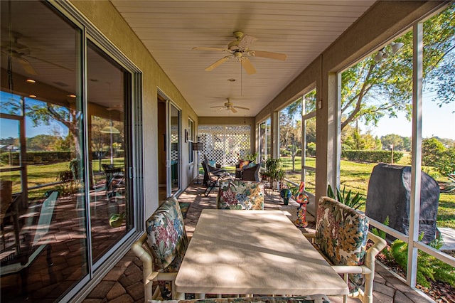 13968 SE 96th Cir, Summerfield, FL 34491 - unfurnished sunroom with outdoor dining area and ceiling fan