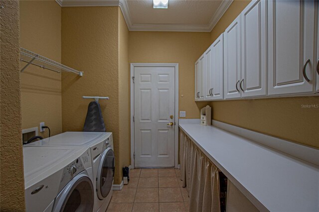 13968 SE 96th Cir, Summerfield, FL 34491 - laundry area featuring cabinet space, independent washer and dryer, ornamental molding, light tile patterned floors, and a textured wall