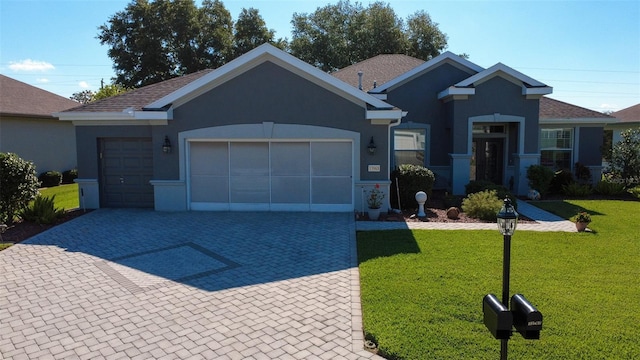 13968 SE 96th Cir, Summerfield, FL 34491 - view of front of home with decorative driveway, an attached garage, a front yard, and stucco siding
