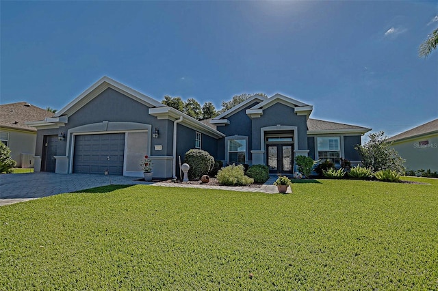 13968 SE 96th Cir, Summerfield, FL 34491 - view of front facade with french doors, a front lawn, an attached garage, stucco siding, and driveway