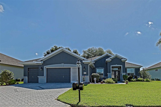 13968 SE 96th Cir, Summerfield, FL 34491 - ranch-style home with stucco siding, an attached garage, a front yard, decorative driveway, and french doors