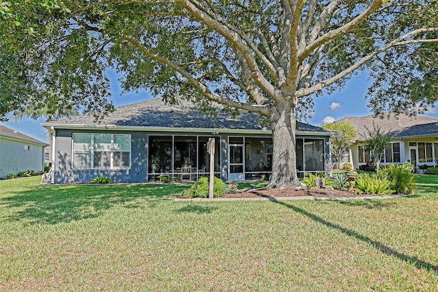 13968 SE 96th Cir, Summerfield, FL 34491 - view of front of house with a sunroom and a front yard
