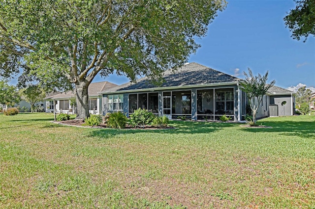 13968 SE 96th Cir, Summerfield, FL 34491 - rear view of property featuring a sunroom, a yard, and a shingled roof