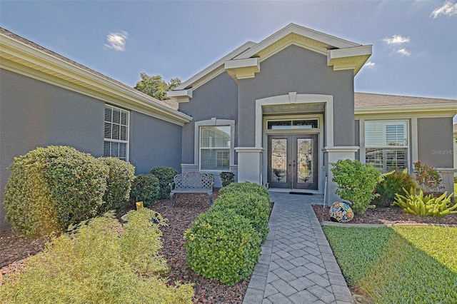 13968 SE 96th Cir, Summerfield, FL 34491 - doorway to property featuring stucco siding