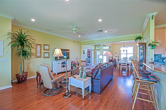 13968 SE 96th Cir, Summerfield, FL 34491 - living area with wood finished floors, a ceiling fan, crown molding, recessed lighting, and baseboards