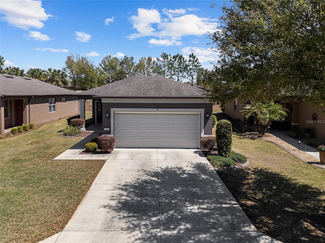 view of front of home with stucco siding, an attached garage, concrete driveway, and a front yard