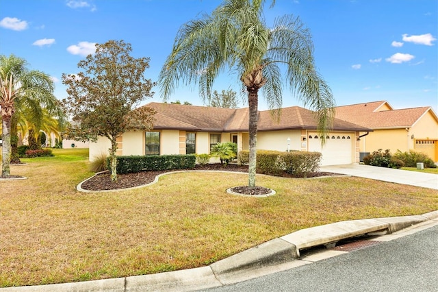 single story home featuring a front lawn, an attached garage, driveway, and stucco siding