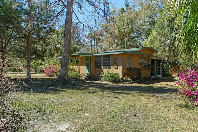 5368 S Parkland Ter, Homosassa, FL 34448 - exterior space with a front yard and stucco siding