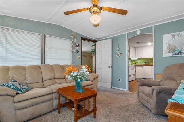 5368 S Parkland Ter, Homosassa, FL 34448 - living area with baseboards, arched walkways, a ceiling fan, carpet floors, and lofted ceiling