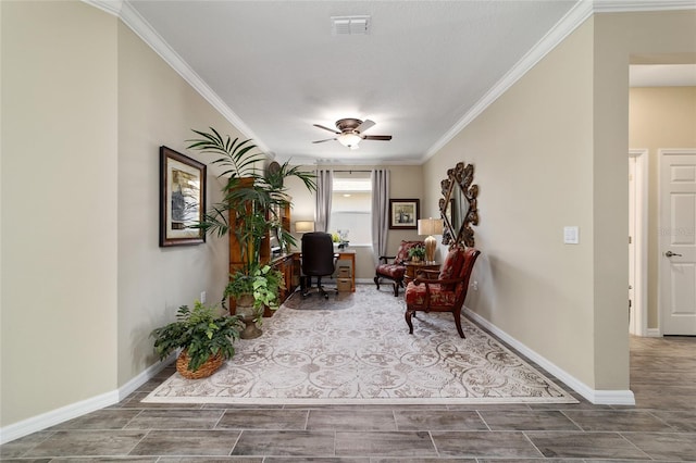 sitting room featuring baseboards, visible vents, ornamental molding, and a ceiling fan