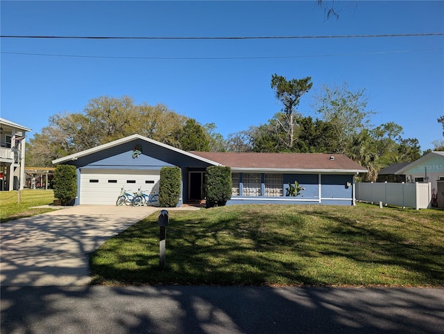 3713 N Suwanee Pt, Crystal River, FL 34428 - view of front facade featuring a front yard, fence, a garage, and driveway