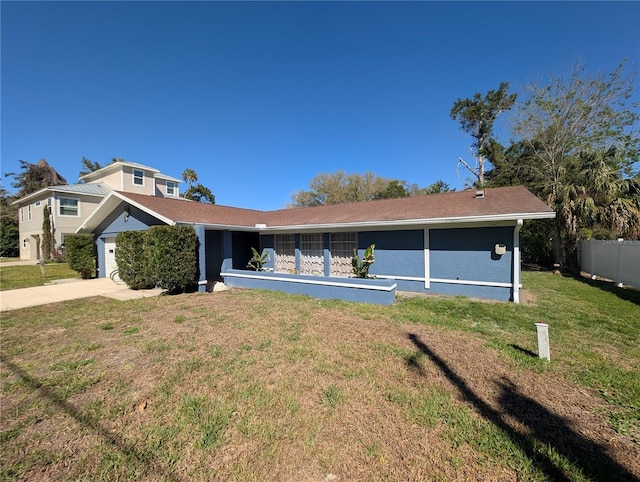 3713 N Suwanee Pt, Crystal River, FL 34428 - view of front of house featuring a garage, concrete driveway, a front lawn, and fence