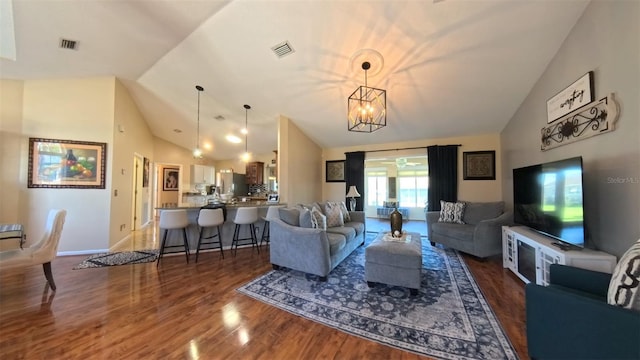 5291 NW 20th Pl, Ocala, FL 34482 - living room featuring visible vents, baseboards, an inviting chandelier, and wood finished floors