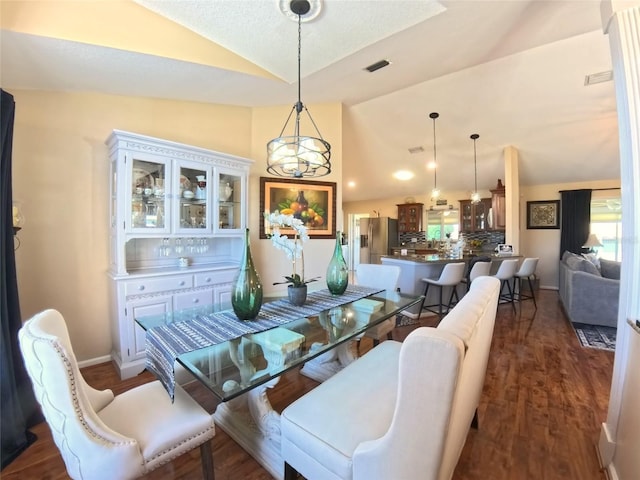 5291 NW 20th Pl, Ocala, FL 34482 - dining room with visible vents, baseboards, dark wood-type flooring, and lofted ceiling