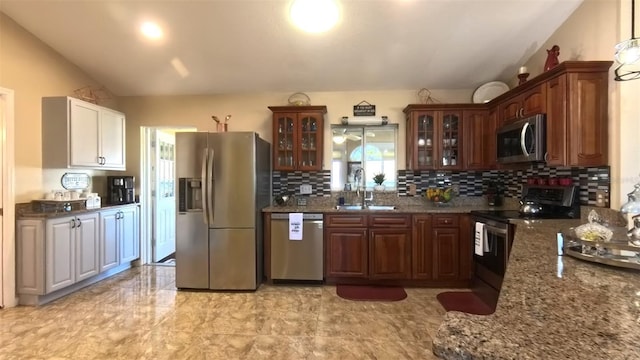 5291 NW 20th Pl, Ocala, FL 34482 - kitchen with backsplash, glass insert cabinets, appliances with stainless steel finishes, and a sink