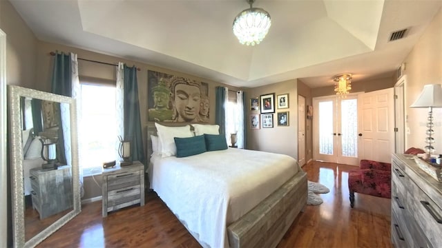 5291 NW 20th Pl, Ocala, FL 34482 - bedroom featuring a tray ceiling, french doors, and visible vents