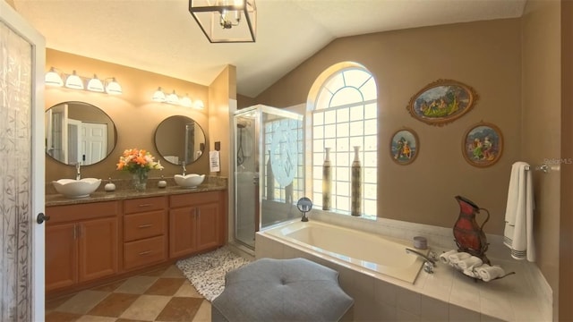 5291 NW 20th Pl, Ocala, FL 34482 - bathroom featuring a bath, plenty of natural light, a stall shower, and vaulted ceiling