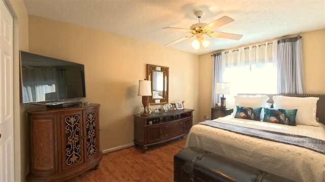5291 NW 20th Pl, Ocala, FL 34482 - bedroom featuring a ceiling fan, wood finished floors, and baseboards