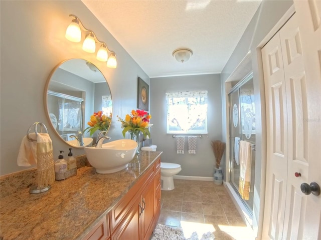 5291 NW 20th Pl, Ocala, FL 34482 - full bathroom featuring vanity, toilet, baseboards, and a stall shower