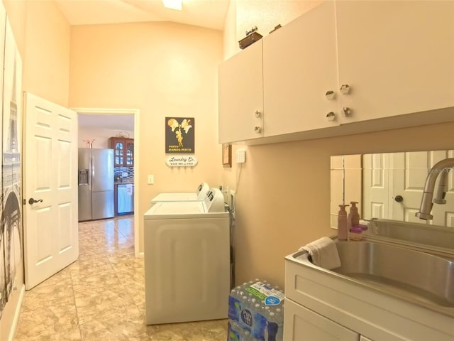 5291 NW 20th Pl, Ocala, FL 34482 - washroom featuring washer and dryer, a high ceiling, cabinet space, and a sink