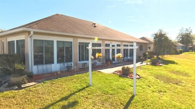 5291 NW 20th Pl, Ocala, FL 34482 - rear view of house featuring roof with shingles, cooling unit, a yard, a sunroom, and a patio area