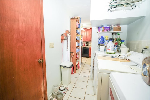 390 SW Shorewood Dr, Dunnellon, FL 34431 - clothes washing area featuring light tile patterned flooring, laundry area, and washing machine and dryer