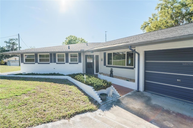 390 SW Shorewood Dr, Dunnellon, FL 34431 - single story home featuring driveway, roof with shingles, a front yard, and an attached garage