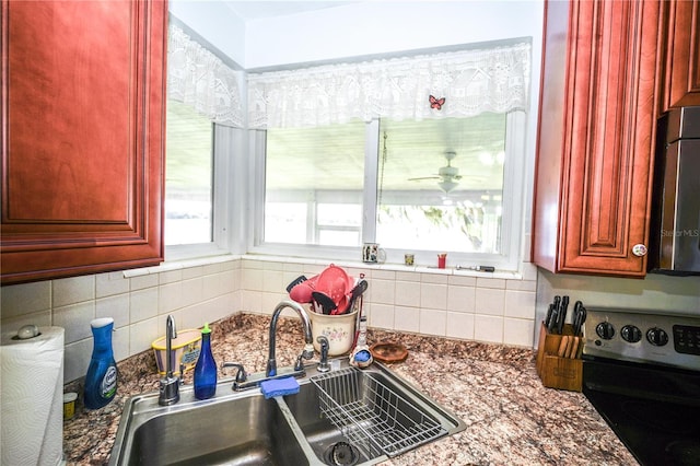 390 SW Shorewood Dr, Dunnellon, FL 34431 - kitchen featuring backsplash, a sink, dark brown cabinets, and stainless steel appliances