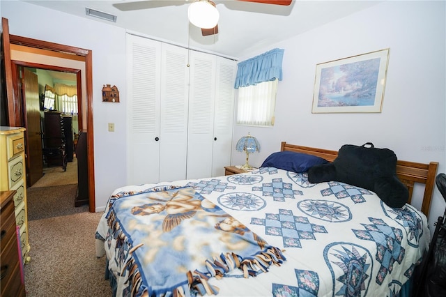 390 SW Shorewood Dr, Dunnellon, FL 34431 - carpeted bedroom with a closet, visible vents, and ceiling fan