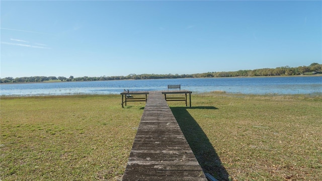 390 SW Shorewood Dr, Dunnellon, FL 34431 - view of dock featuring a lawn and a water view