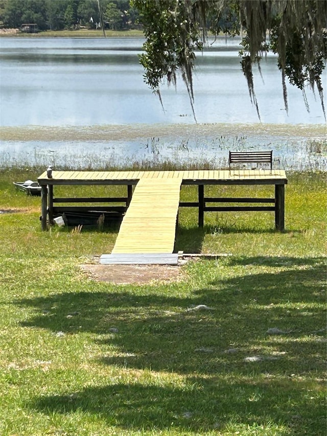 390 SW Shorewood Dr, Dunnellon, FL 34431 - view of dock with a lawn and a water view
