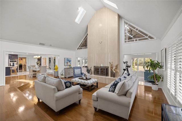 2130 SW 37th Street Rd, Ocala, FL 34471 - living area with visible vents, high vaulted ceiling, wood finished floors, and ornamental molding