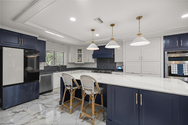 2130 SW 37th Street Rd, Ocala, FL 34471 - kitchen featuring backsplash, a tray ceiling, appliances with stainless steel finishes, blue cabinets, and a sink