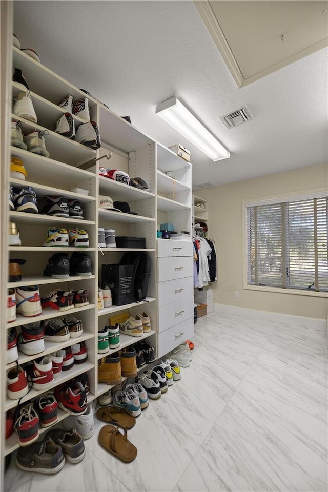 2130 SW 37th Street Rd, Ocala, FL 34471 - spacious closet with attic access, visible vents, and marble finish floor