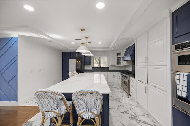 2130 SW 37th Street Rd, Ocala, FL 34471 - kitchen with premium range hood, recessed lighting, white cabinets, appliances with stainless steel finishes, and marble finish floor
