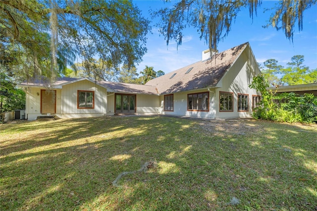 2130 SW 37th Street Rd, Ocala, FL 34471 - back of property with a yard, french doors, and a chimney
