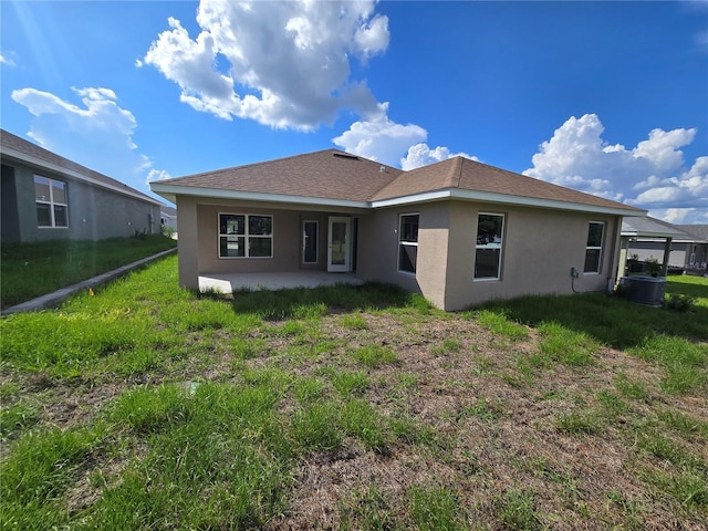 5045 N Triple Eagle Path, Beverly Hills, FL 34465 - rear view of property featuring stucco siding and a patio area