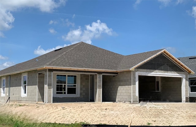 310 W Rexford Dr, Beverly Hills, FL 34465 - view of front of property featuring a shingled roof and concrete block siding