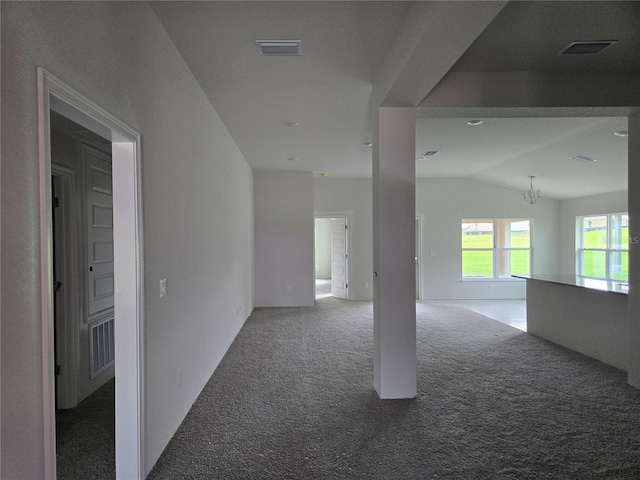 310 W Rexford Dr, Beverly Hills, FL 34465 - spare room featuring carpet floors, vaulted ceiling, and a chandelier