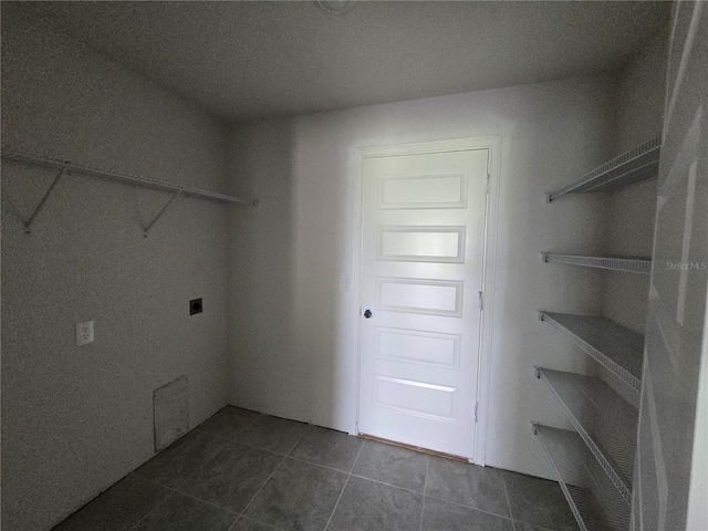 310 W Rexford Dr, Beverly Hills, FL 34465 - laundry room featuring dark tile patterned flooring and hookup for an electric dryer