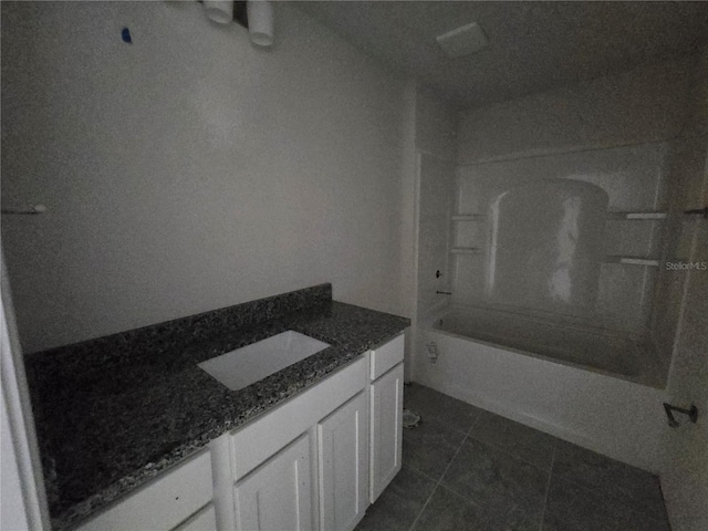 310 W Rexford Dr, Beverly Hills, FL 34465 - full bathroom featuring vanity, bathtub / shower combination, and tile patterned floors