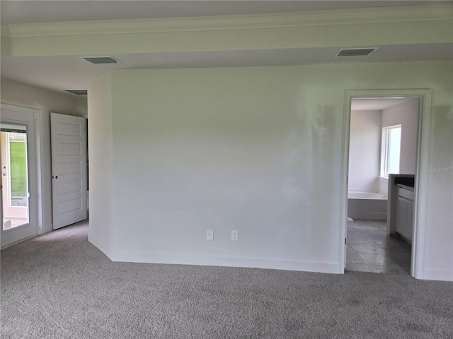 310 W Rexford Dr, Beverly Hills, FL 34465 - carpeted spare room with baseboards and crown molding