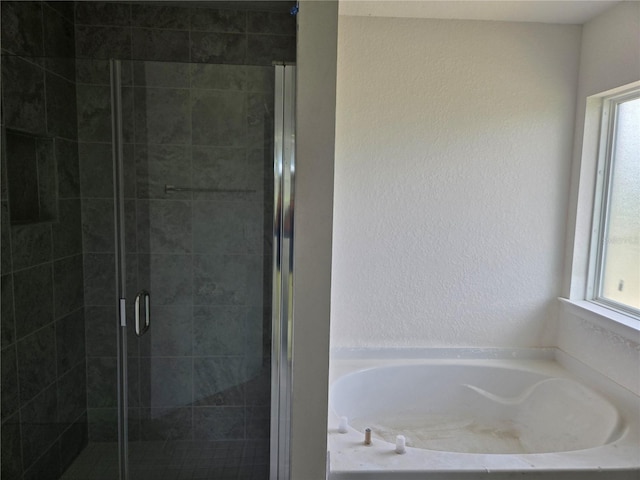 310 W Rexford Dr, Beverly Hills, FL 34465 - full bath featuring a bath, a shower stall, and a textured wall